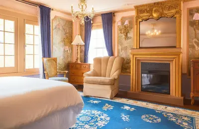 a bedroom with a bed and a fireplace at Iconic Hollywood Homestay Near Walk Of Fame in Los Angeles
