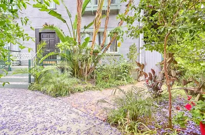 a garden with plants and a house at Iconic Hollywood Homestay Near Walk Of Fame in Los Angeles