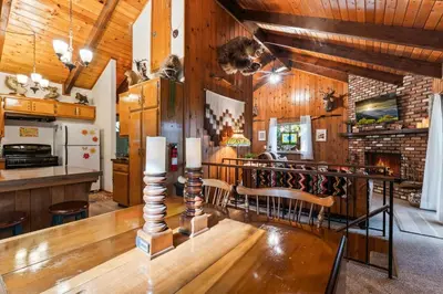 a dining room with a table and chairs in a room at Retro Retreat, BBQ, Patio with Outdoor Seating! in Lake Arrowhead