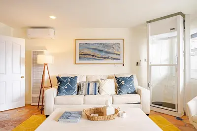 a living room with a couch and a table at Amazing location, Unique Oceanfront Beach House! in Manhattan Beach
