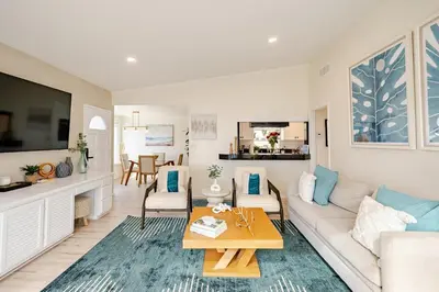 a living room with a couch and a table at Amazing location, Unique Oceanfront Beach House! in Manhattan Beach