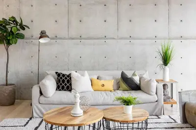a living room with a couch and two tables at Modern Villa Hollywood Hills Sanctuary in Los Angeles
