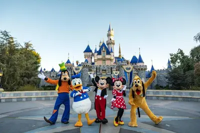 a group of mascots in front of the disney castle at Urban Chic Home 10 Min from Disneyland With Pool & GYM in Santa Ana