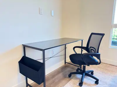 a desk and a chair in an office at Stunning Haven with Pool Gym Parking Close to Disneyland in Santa Ana