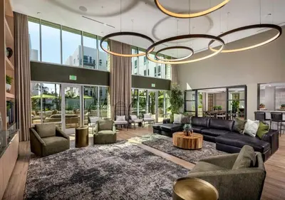 a living room with couches and a chandelier at Elegant Escape 10 Min from Disneyland With Pool & GYM in Santa Ana