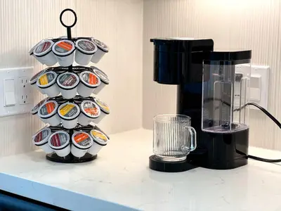a rack of cups on a counter next to a blender at Elegant Escape 10 Min from Disneyland With Pool & GYM in Santa Ana