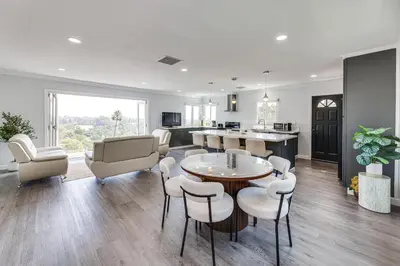 a kitchen and living room with a table and chairs at Enchanting 4-bedroom house with panoramic view in Pasadena in Los Angeles