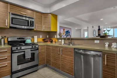 a kitchen with a stove and a microwave at Amazing Spacious Unit in Heart of LA- Melrose district in Los Angeles
