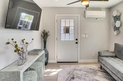 a living room with a couch and a table at Newly Updated! Commuter-Friendly Anaheim Home in Anaheim
