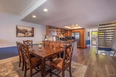 a dining room with a wooden table and chairs at Lake Forest Shores at Big Bear Lake in Big Bear Lake