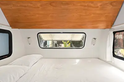 a white room with a bed and a window at Urban Farmhouse in Venice Walk to Abbot Kinney w Patio and Parking in Los Angeles