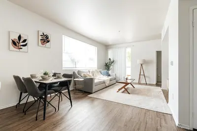 a living room with a couch and a table at Pearl 2B apartment in Marina with parking, Pool and Gym in Los Angeles