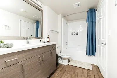a bathroom with a sink and a toilet and a shower at Pearl 2B apartment in Marina with parking, Pool and Gym in Los Angeles