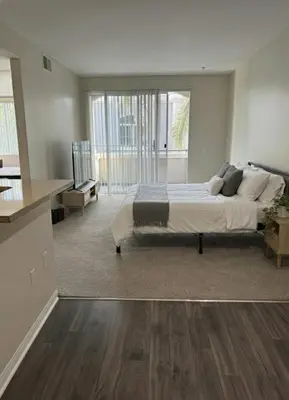 a large bedroom with a bed and a kitchen at Marina del Rey Family 1BA & 2BA - Pool, Spa and Gym Access in Los Angeles