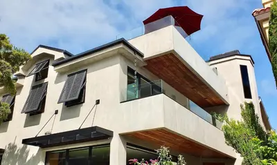 a building with a red umbrella on top of it at Naples Luxury Retreat - 3 BDR Stay for 6 w Rooftop Patio in Long Beach