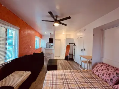 a living room with a couch and a ceiling fan at Beautiful Venice Beach in Los Angeles