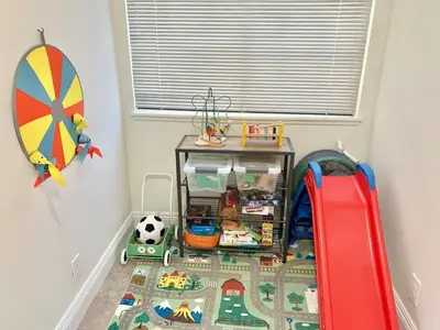 a room with a table with toys on a floor at CA3 House Spacious SoCal Home for Groups in La Palma