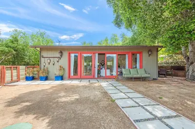 a small shed with a red door at Cornell Canyon Getaway in Agoura Hills