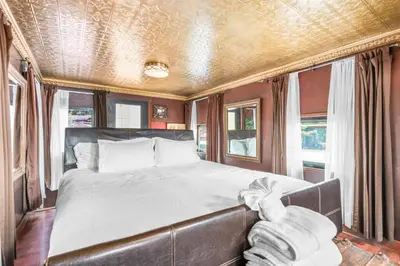 a bedroom with a bed in a train car at Cornell Canyon Getaway in Agoura Hills