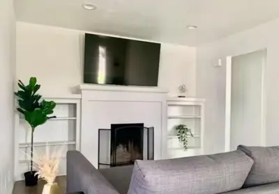 a living room with a couch and a fireplace at CA5 House Cozy 3BR in Azusa in Azusa
