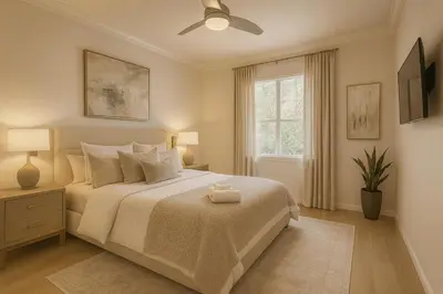 a bedroom with a white bed with a ceiling fan at Marina del Rey 2BR with Pool, Hot Tub, and Gym in Los Angeles