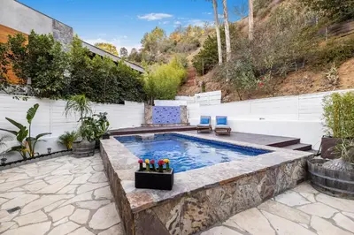 a swimming pool in a yard with a patio at Shirley Lane in Los Angeles