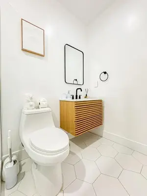 a white bathroom with a toilet and a sink at Relaxing 2BR Escape in Trendy West LA - CM-CAL in Calabasas