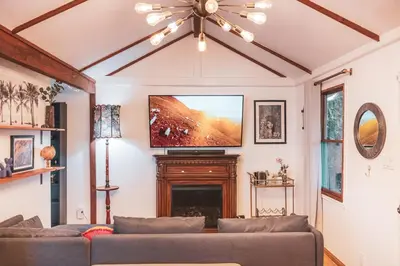 a living room with a couch and a flat screen tv at Modern & Airy Silver Lake 2bedroom 2 bath Front House in Los Angeles