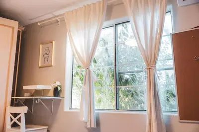 a window with white curtains in a room at Modern & Airy Silver Lake 2bedroom 2 bath Front House in Los Angeles