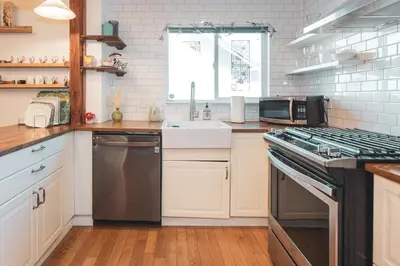 a kitchen with a sink and a stove top oven at Modern & Airy Silver Lake 2bedroom 2 bath Front House in Los Angeles