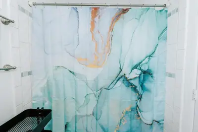 a shower curtain in a bathroom with a blue at Serene Silver Lake 1 bedroom 1 bathroom Back house With Private Backyard in Los Angeles