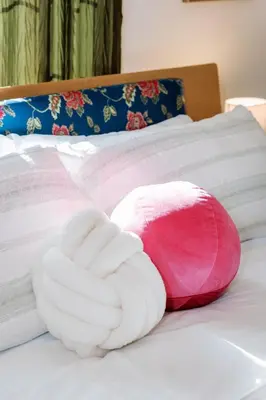 a towel animal shaped like a hand sitting on a bed at Serene Silver Lake 1 bedroom 1 bathroom Back house With Private Backyard in Los Angeles