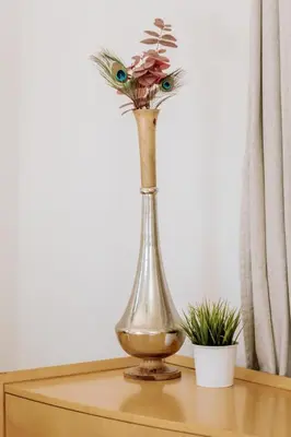 a vase with a flower in it on a table at Serene Silver Lake 1 bedroom 1 bathroom Back house With Private Backyard in Los Angeles