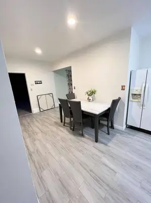a dining room with a table and chairs at Hacienda New Remodeled 17miles-Disney in Hacienda Heights