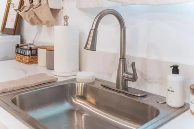 a kitchen counter with a sink in a kitchen at Welcoming Claremont Studio With Private Yard and Pool Spa in Claremont