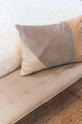 a pillow sitting on top of a couch at Welcoming Claremont Studio With Private Yard and Pool Spa in Claremont