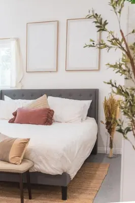 a bedroom with a bed with pillows on it at Welcoming Claremont Studio With Private Yard and Pool Spa in Claremont