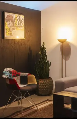 a living room with a couch and a chair and a plant at 1400 square foot Arts District Warehouse Loft 1 bedroom 1 bathroom in Los Angeles