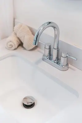 a kitchen sink with a faucet and a towel at Renovated 1 Bedroom 1 bathroom Cottage Near Larchmont Village in Los Angeles