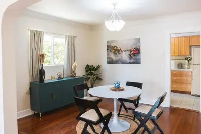 a dining room with a table and chairs at Charming Vintage 2 bedroom 1 Bathroom Close to Larchmont Village in Los Angeles