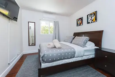 a bedroom with a bed with two pillows on it at Charming Vintage 2 bedroom 1 Bathroom Close to Larchmont Village in Los Angeles