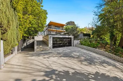 a driveway in front of a house with a garage at Farley Court in Los Angeles