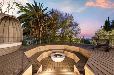 a patio with a fire pit on a deck at Farley Court in Los Angeles