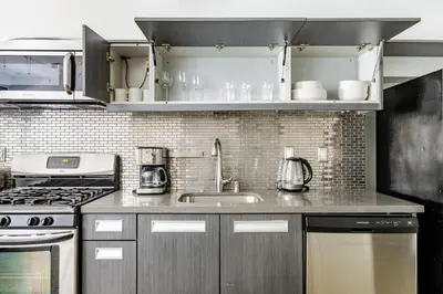 a kitchen with a sink and a stove at Blueground Historic Core view nr Grand Park LAX-1424 in Los Angeles