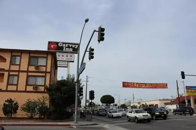 a street corner with a traffic light and a building at Garvey Inn Hotel - \u5c0f\u53f0\u5317\u9152\u5e97, Monterey Park in Monterey Park