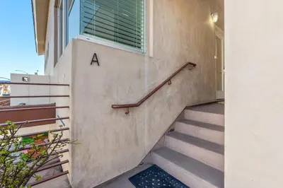 a staircase with the letter a on the side of a building at Ocean View condo in the heart of Manhattan Beach in Manhattan Beach