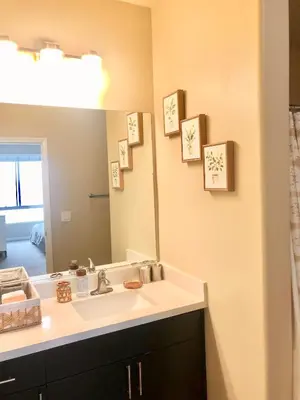 a bathroom with a sink and a mirror at Spacious 2B 2B Pool View Loft Apartment in Marina Del Rey in Los Angeles