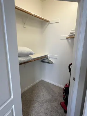 a walk in closet with a bed in it at Spacious 2B 2B Pool View Loft Apartment in Marina Del Rey in Los Angeles