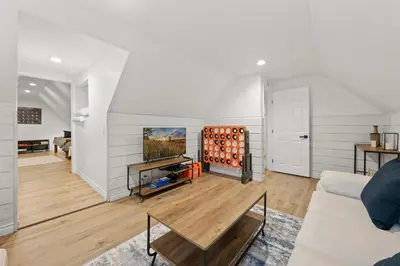 a living room with a couch and a table at Navigate Stays 5BR Group Lodge Near Mountain & Fun in Big Bear Lake