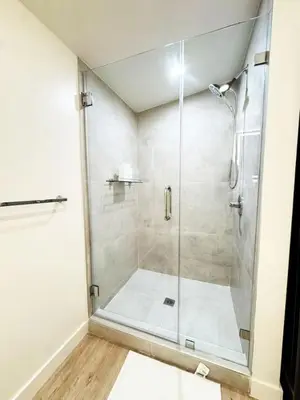 a shower with a glass door in a bathroom at Chic Studio Haven by Century City - FH2 - BV in Los Angeles